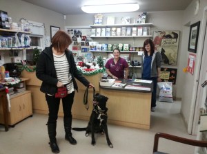 The team at Maple Leaf Pet Corner veterinary office: canine educator Colleen Wells (from left), Toby, Dr. Julia McNeal and veterinary technician Aisha Graham